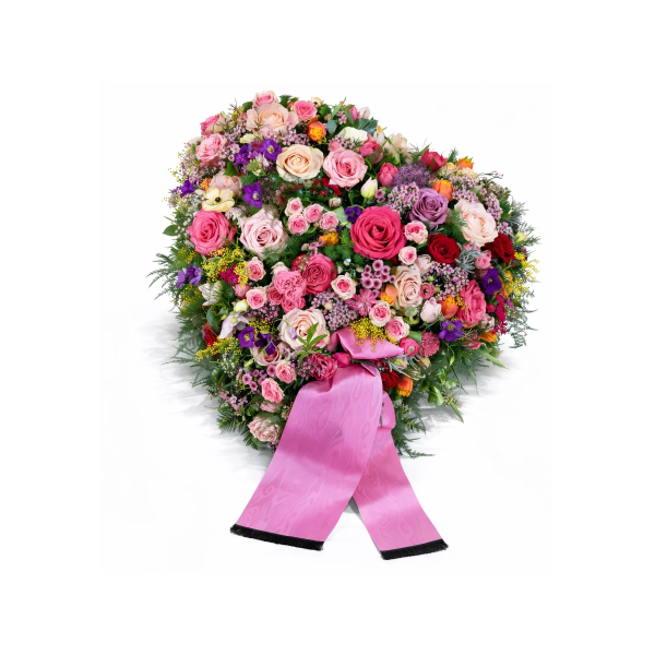 Farbenfroher Trauerkranz mit Rosen und rosa Schleife